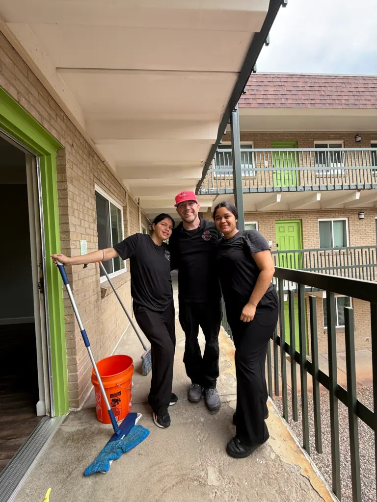 Three Reina's Cleaning team members at a job